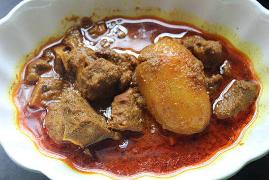 Beef bhuna with whole potato in a thick gravy